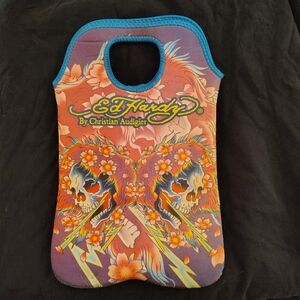 Ed Hardy Skulls and Lightening cloth bag. Nice thick wetsuit type material.